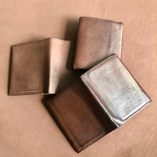 Load image into Gallery viewer, Premium Vegetable tanned Kangaroo leather, gradually gets darker with use and time. This photo shows one wallet which has been used for several months, the second from the top has been used for one month and the base wallet is new
