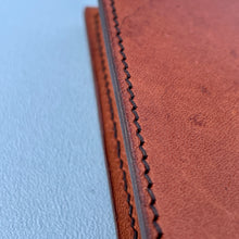 Load image into Gallery viewer, detailed image showing perfect stitching in tan travel wallet
